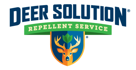 Deer Solution Repellent Service logo featuring a deer with a leaf between its antlers, inside a shield with the company name.