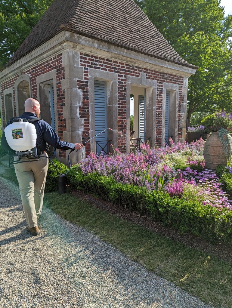 A Deer Solution technician treats this property to help protect the landscape from hungry deer.